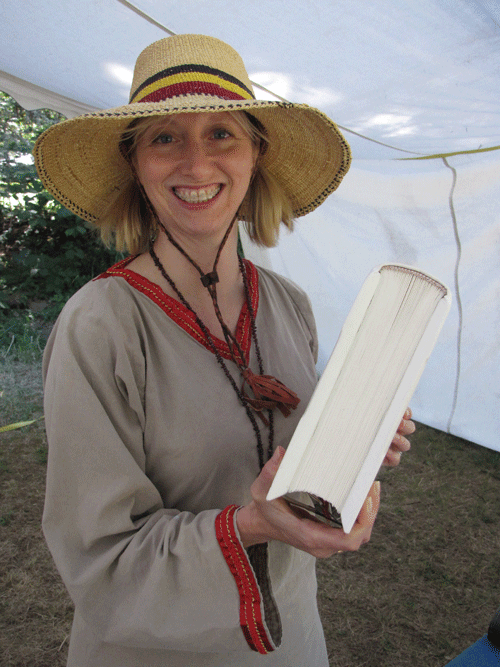 Sabine holding recent entry to the Kingdom Arts and Sciences Championship competition.